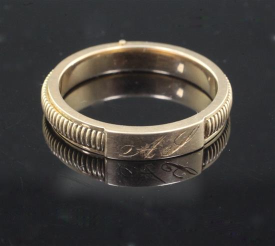 A Victorian milled gold hinged twin compartment mourning band, size Q/R.